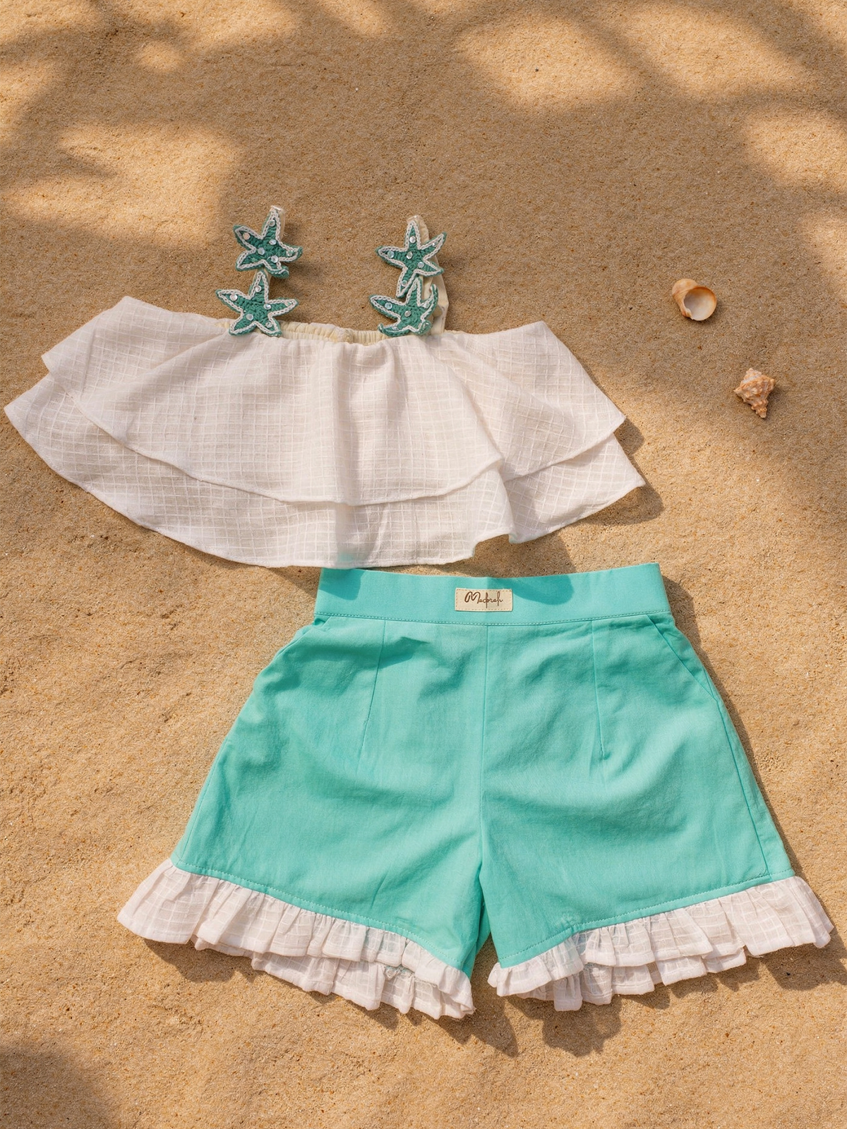 White umbrella top with aqua green shorts