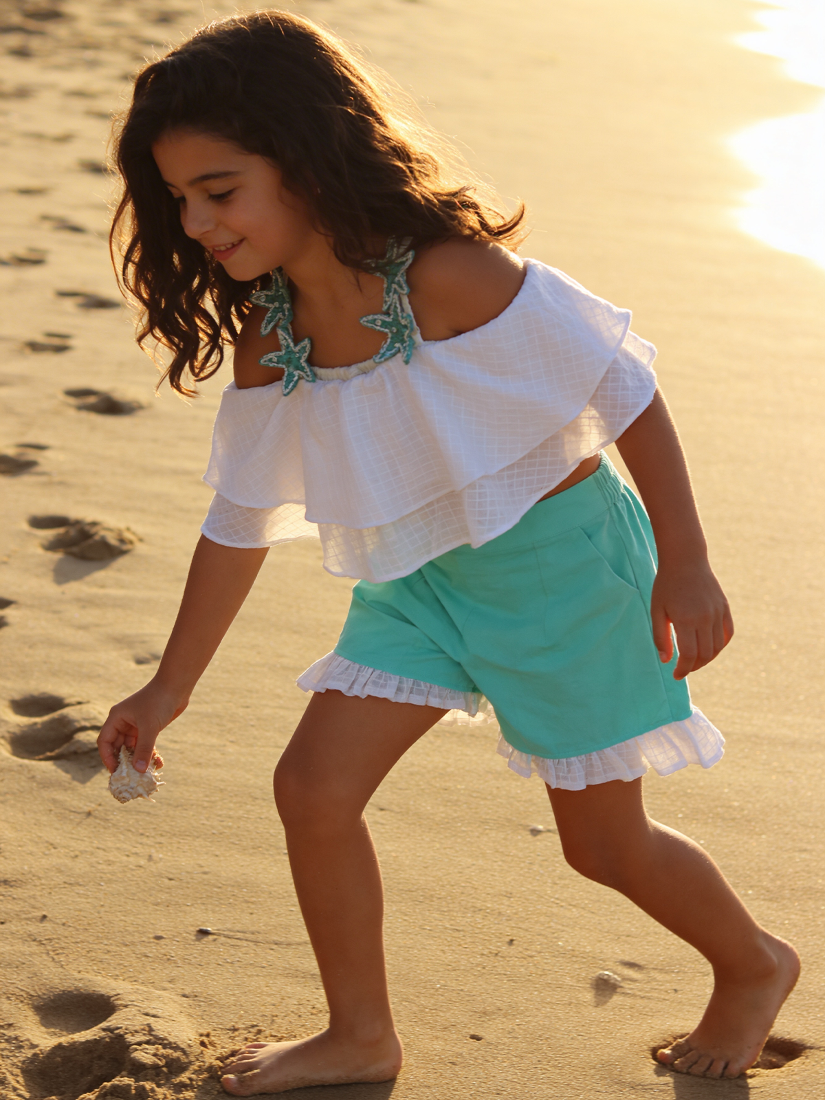White umbrella top with aqua green shorts